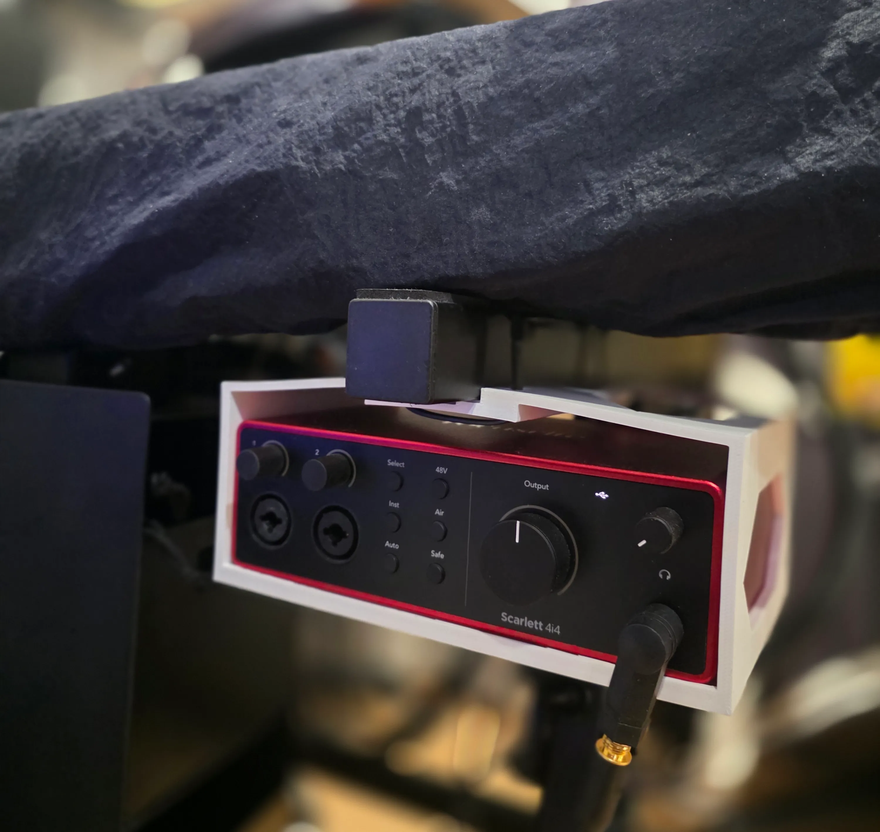 The audio interface installed under the keyboard stand
